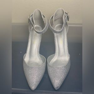 Brand new glittery silver heels. Never worn.